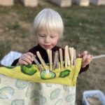 kid with laundry clips