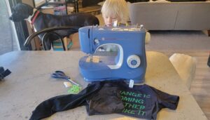 little boy and sewing machine