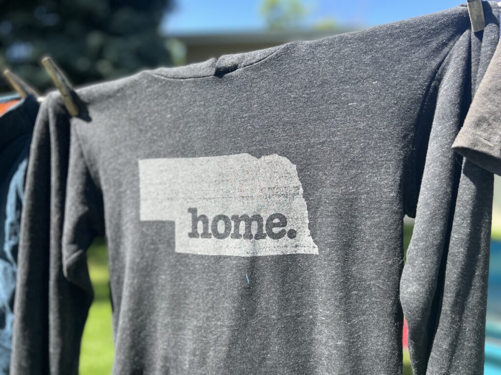 nebraska home sweatshirt on laundry line